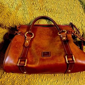 Dooney and Bourke in very good condition has some scuff marks on bottom edges